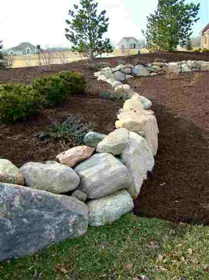 Granite boulders are just one of the many types of natural stone we carry. We also have a variety of flagstone and wall stone that are ideal for enhancing your landscaping project. <br />