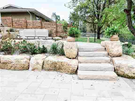 Extensive rock and boulder work artfully done to naturalize and stabilize a steep slope at this cabin near Kenora Ontario