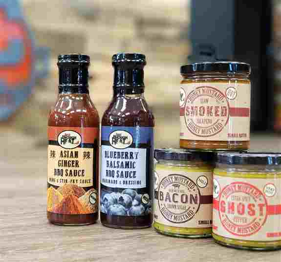 Asian Ginger & Blueberry Balsamic BBQ Sauce as well as Bacon Brown Sugar, Smoked Jalapeno and Ghost Pepper Honey Mustard
