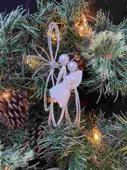 Handcrafted colored wire beaded poinsettia  ornament with 14mm center beads. Approximately 5" diameter