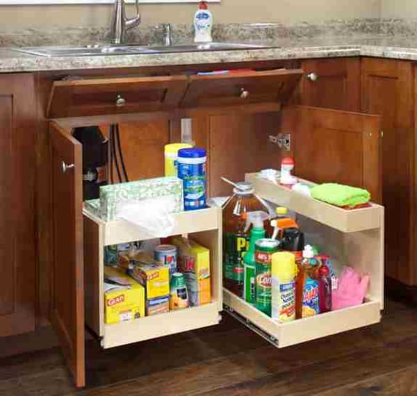 Even under the kitchen sink, custom two-level glide outs can store household chemicals, cleaning products, and other items typically found under a sink, while leaving room and access for the plumbing.