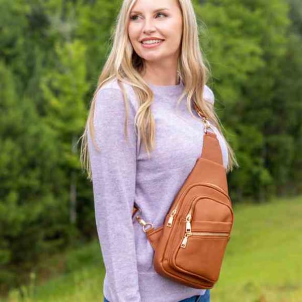 The Abby Crossbody - Wear as a clutch, wristlet, or crossbody handbag!  The Abby is the medium size bag of the 3 crossbody's carried in the boutique.