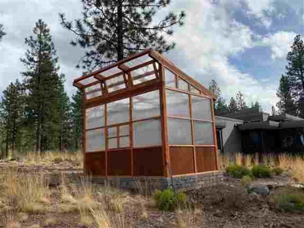 12'x8' Premium Modern Slant Greenhouse. Included Dutch Door, French Window, 18" Modular Benches, and 13" Modular Shelves. Our Inlay Wainscoting offers added insulation as well as durability. Our Panel Design allows for easy customization.