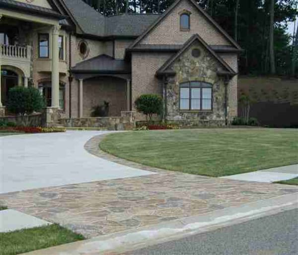 Our Stardek spray texture with hand taped flagstone apron and border.