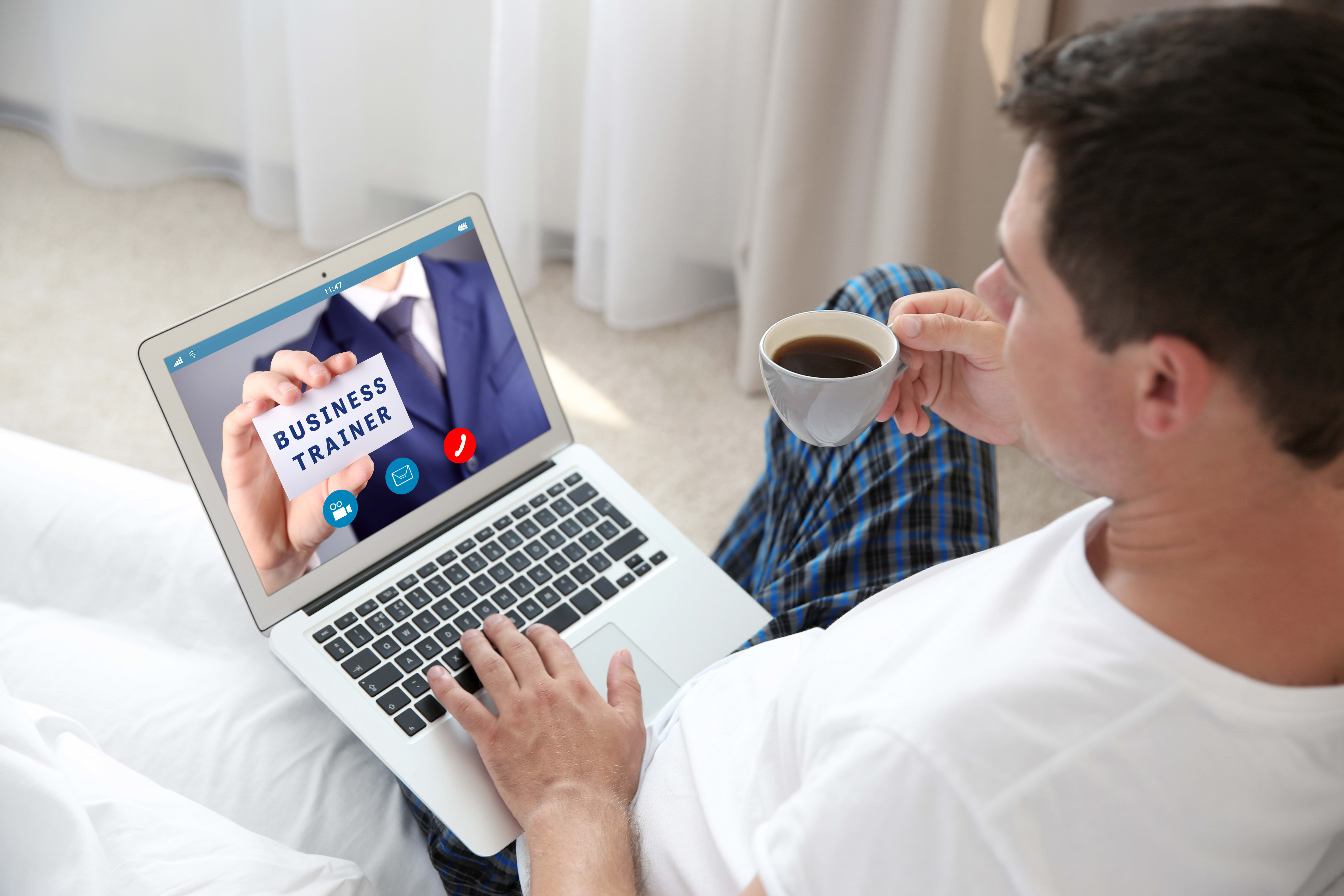 Man video conferencing on laptop. Webinar and consultation online. Modern business technology concept.
