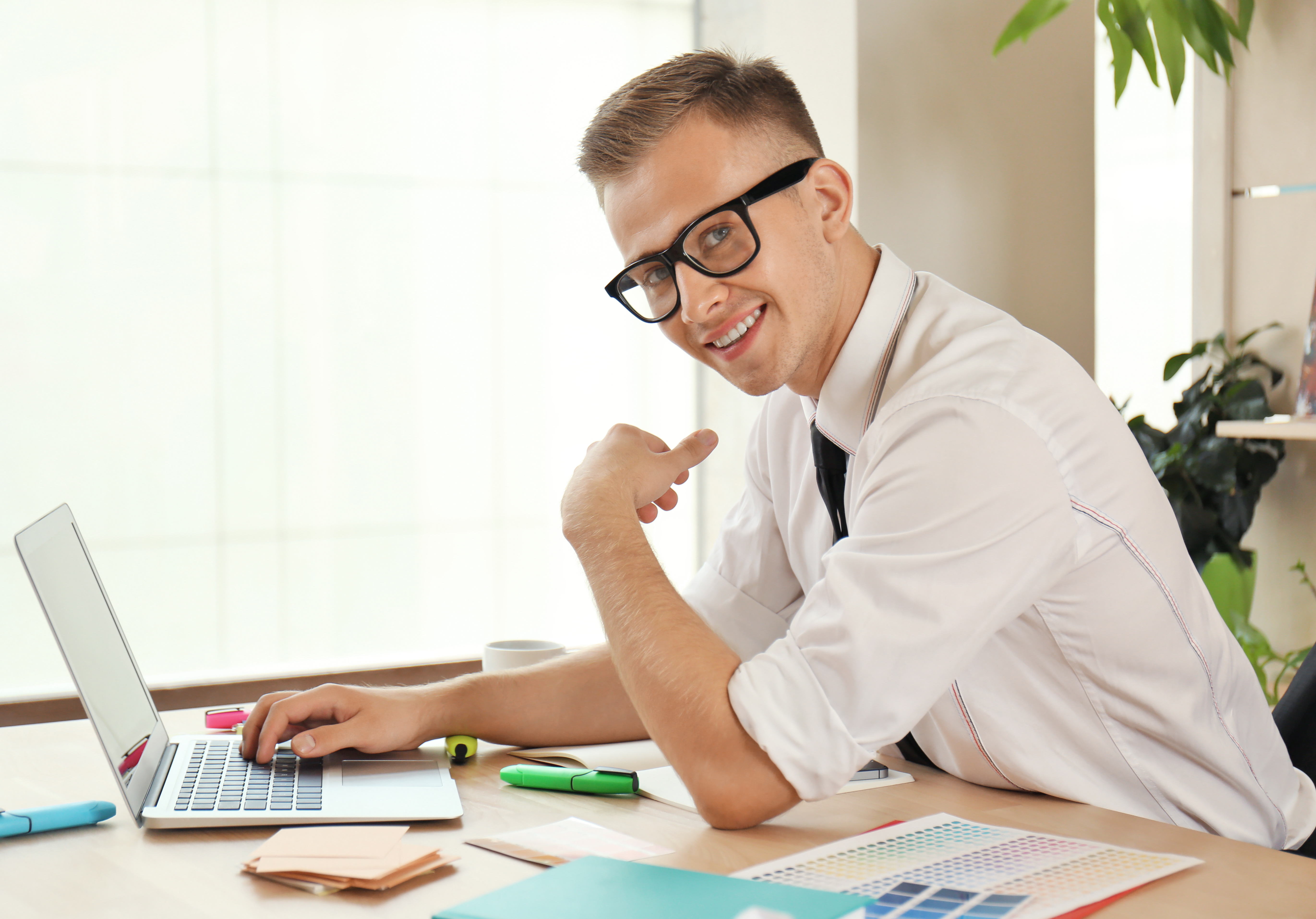 Young man working on laptop in office