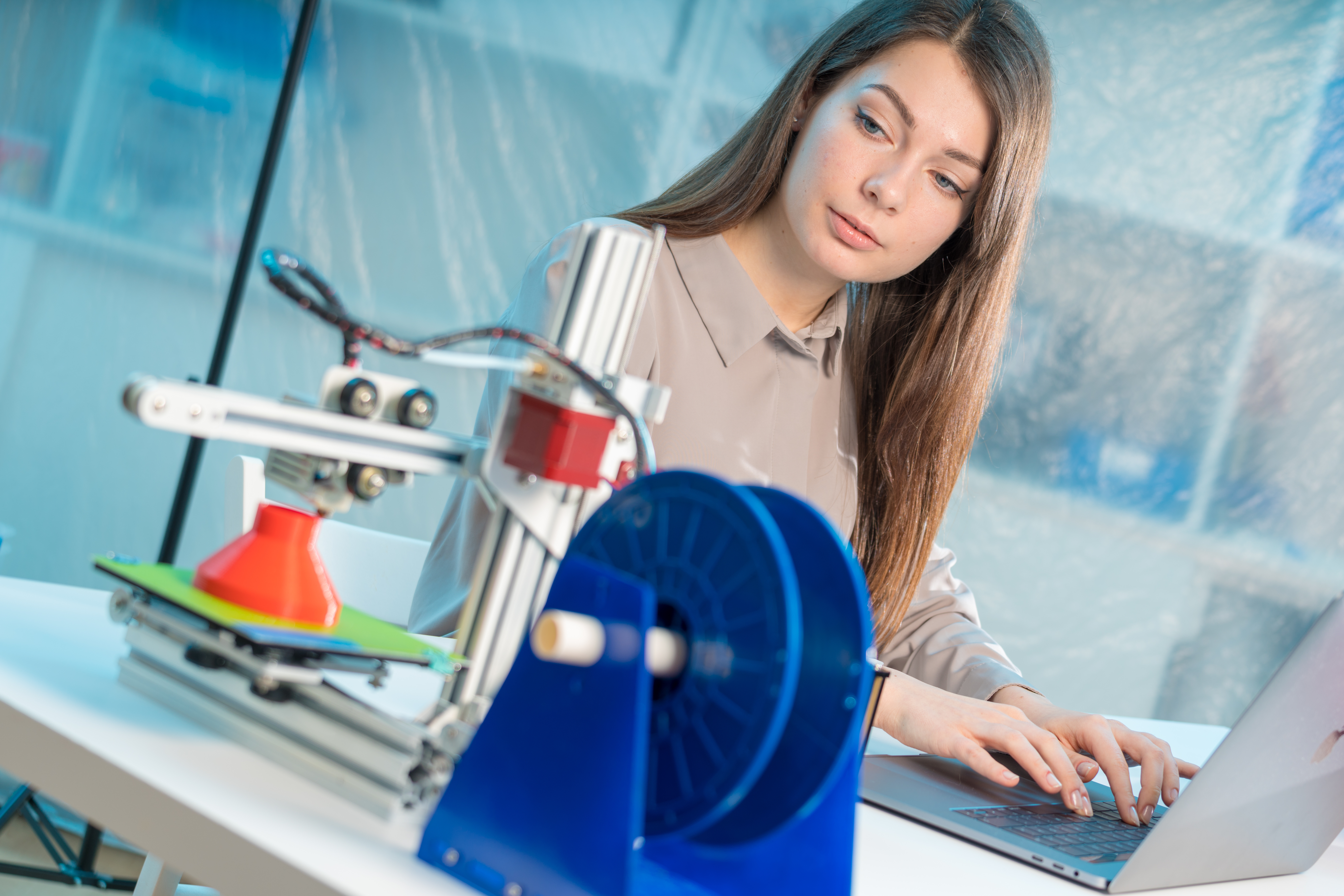 Professional female engineer working with 3d printing