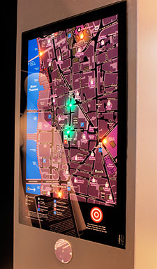 Backlit touchscreen mounted on a wall