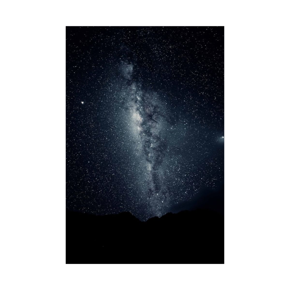 Captivating view of the Milky Way galaxy with a mountain silhouette ...