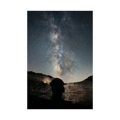 Starry night sky with the Milky Way over rocks in Lazoor, Tehran Province.