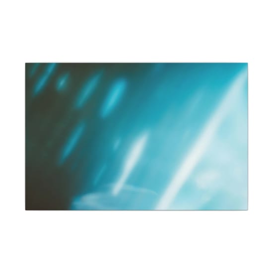 A vibrant and dynamic abstract blue gradient background with smooth textures and glowing effects.