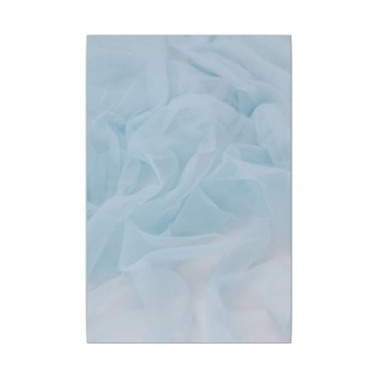 Soft pastel blue silk fabric creating an elegant and smooth texture, perfect for backgrounds or themes of softness and luxury.