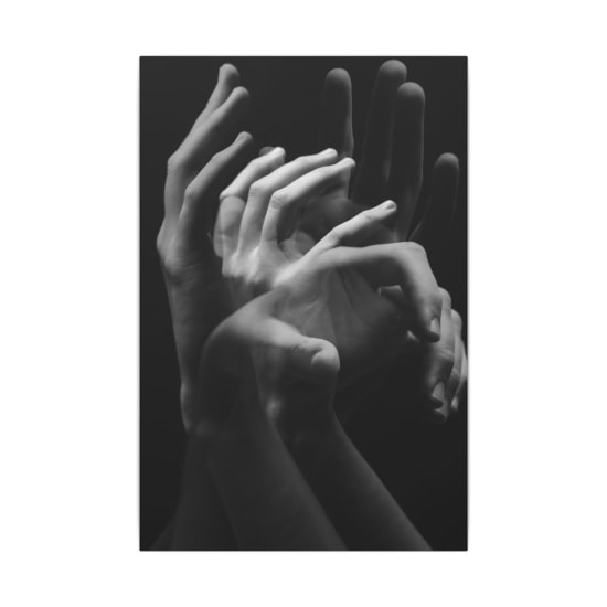 A monochromatic image capturing the fluid motion of hands in a conceptual style.