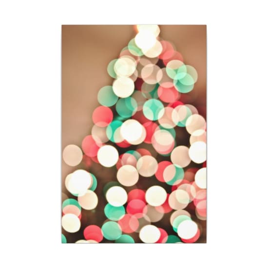 Festive abstract bokeh image of Christmas lights creating a blurred colorful pattern.