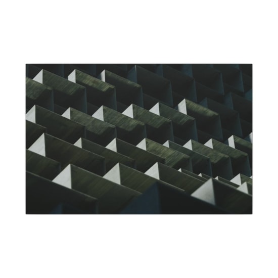 Dynamic geometric pattern of an architectural facade in Toronto, showcasing modern design.