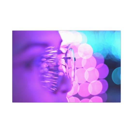 Close-up photo of eyeglasses with bright purple and blue bokeh lights creating an abstract aesthetic.