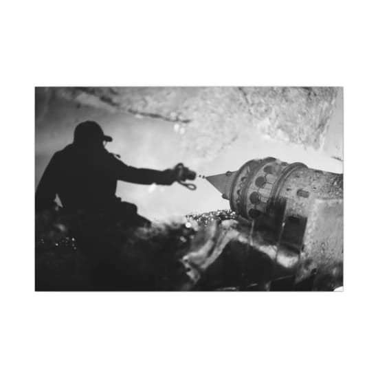 Artistic reflection of Galata Tower with silhouetted figure. Moody and dramatic vibe.