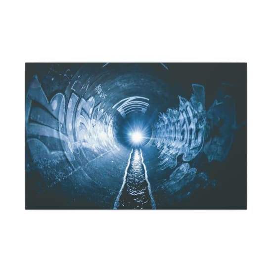 Surreal view of a graffiti-covered tunnel illuminated by a bright light, evoking an eerie atmosphere.