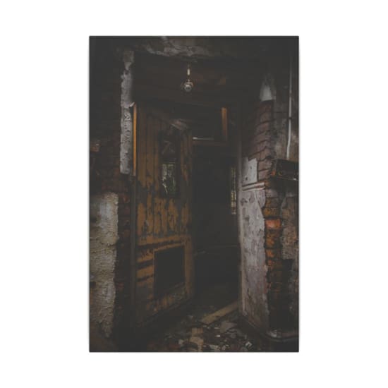 Explore the eerie and decayed remains of an abandoned house in Wales, featuring a broken doorway.