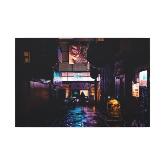 Silhouette of a person walking in a vibrant, neon-lit alleyway in Shinjuku, Tokyo at night.