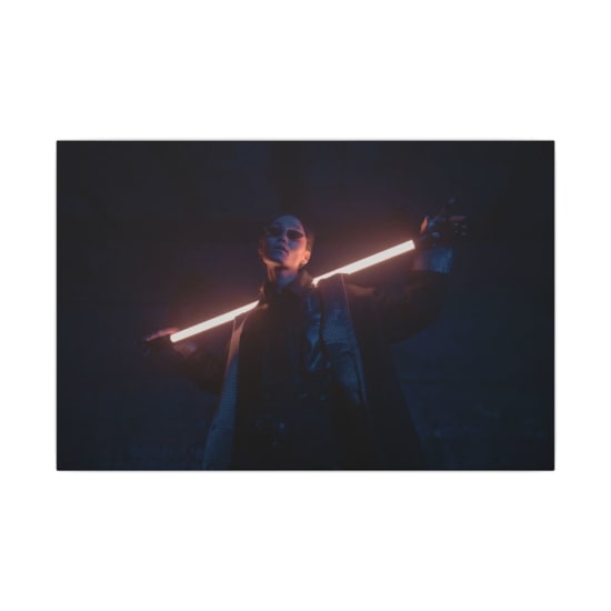 A stylish individual poses with a glowing neon stick in a dark, cyberpunk setting.