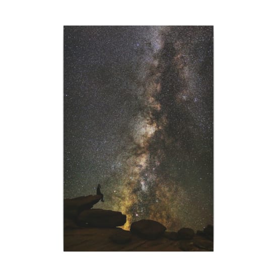 Stunning Milky Way over Horseshoe Bend with a silhouetted figure, perfect for cosmic exploration themes.