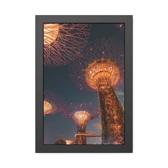 Stunning view of the Supertree Grove illuminated during the night in Singapore, showcasing modern architecture.