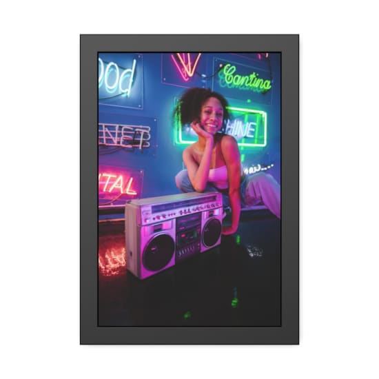 Woman smiling beside a boombox in a vibrant neon-lit room, exuding retro vibes.