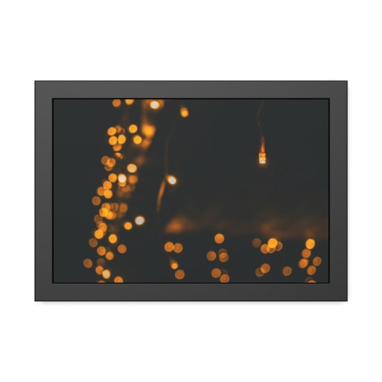 Enchanting warm bokeh effect of festive string lights on a dark background.