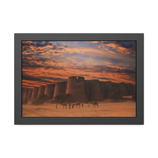 Stunning view of an ancient fort in the desert at sunset, camels and people in foreground.