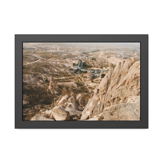 Explore the stunning rocky formations of Cappadocia, Turkey, captured from above with a scenic vista of the arid landscape.