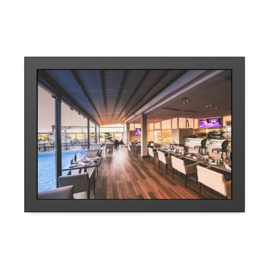 Spacious modern restaurant interior with a poolside view, featuring elegant furniture and contemporary design.