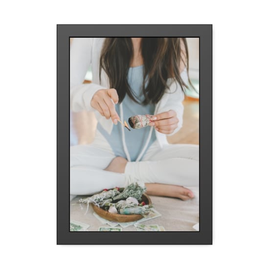 A serene scene of a woman meditating with burning sage and tarot cards.
