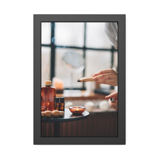 A soothing aromatherapy setup featuring burning sage and a lit candle for relaxation.