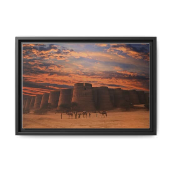 Stunning view of an ancient fort in the desert at sunset, camels and people in foreground.
