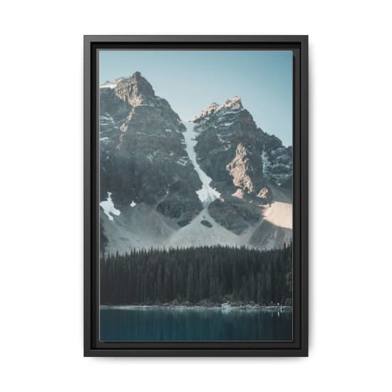 Stunning view of the Canadian Rockies with snow-capped peaks reflecting in Moraine Lake.