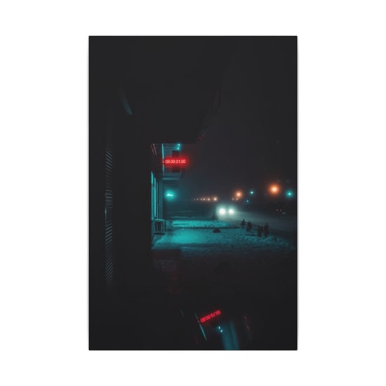 Dramatic night street view with snow and neon signs, perfect for winter urban photography.