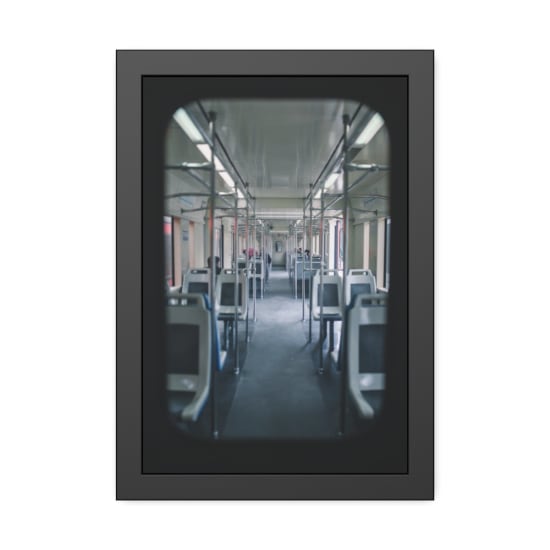 View inside a modern urban train showing empty seats and a clean interior design.