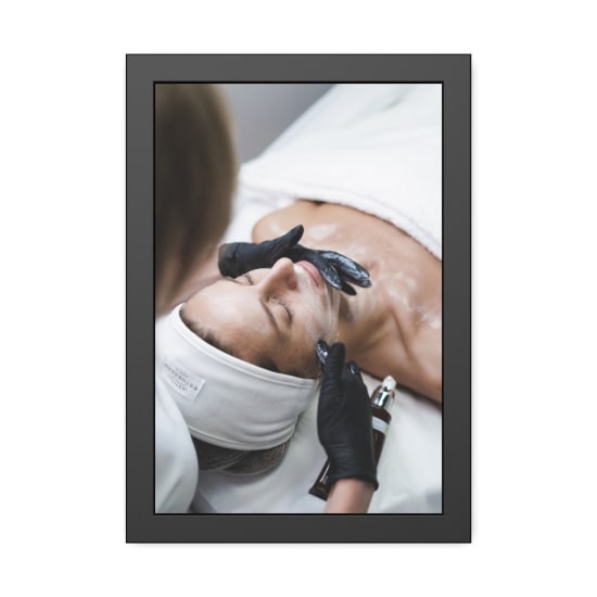 A relaxing skincare session with a woman receiving a facial treatment at a spa.