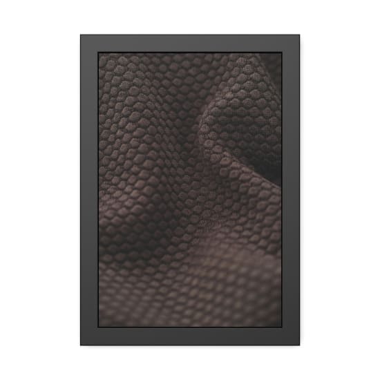 Detailed close-up of brown fabric with a hexagonal pattern, emphasizing softness and texture.