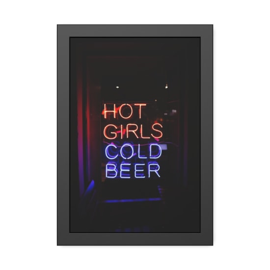 Bright neon sign displaying 'Hot Girls Cold Beer' in vivid colors.
