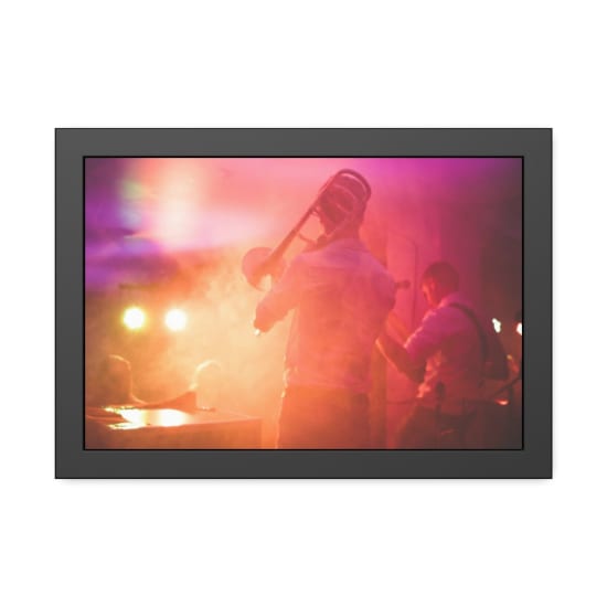 Vibrant live music performance featuring a trombone player on stage in a nightclub setting.