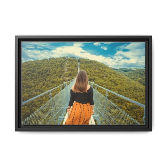 A woman walks along a canopy bridge set amidst a lush green forest and scenic hills.
