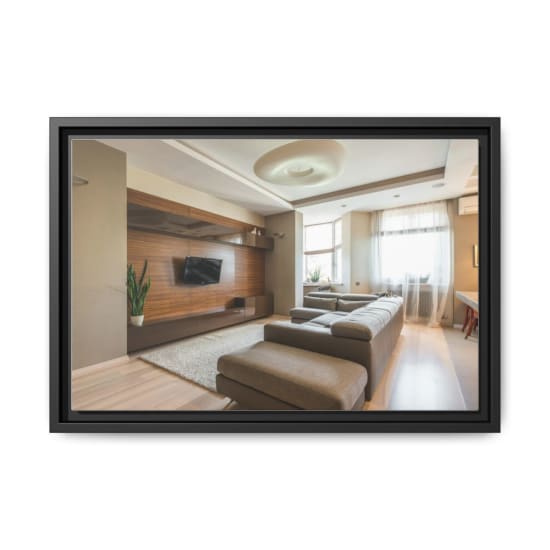 Spacious modern living room with a sleek design, featuring a TV and a comfortable sofa.