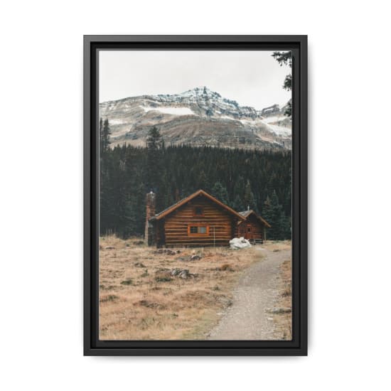 Charming wooden cabin amidst Canadian Rockies, perfect for a serene getaway.