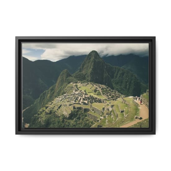 Stunning aerial shot of Machu Picchu with lush green surroundings and majestic mountains.