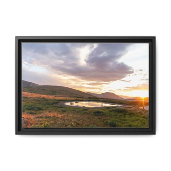 Peaceful sunrise at Montezuma, Colorado with reflections in a mountain lake and vibrant sky.