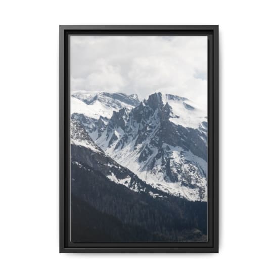 Scenic view of the snowy Alps mountain peaks under a cloudy sky, perfect for adventure and nature lovers.