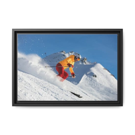 Dynamic capture of a skier racing downhill in snowy mountains, showcasing adrenaline and winter sport excitement.