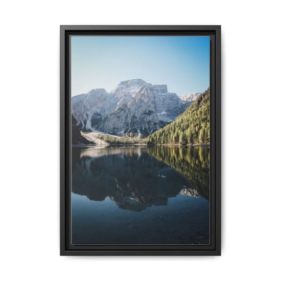 Scenic view of the majestic Dolomites reflecting in a tranquil lake in Trentino-South Tyrol, Italy.
